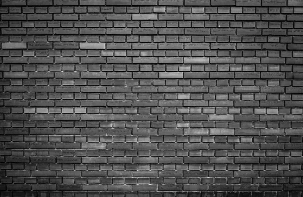 Weathered black brick wall background — Stock Photo, Image