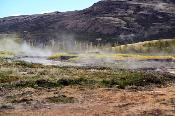 Steaming geothermal hot water Iceland — Stock Photo, Image