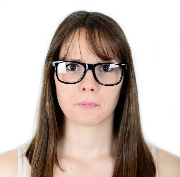 Portret van triest jonge vrouwelijke geïsoleerd op witte achtergrond — Stockfoto