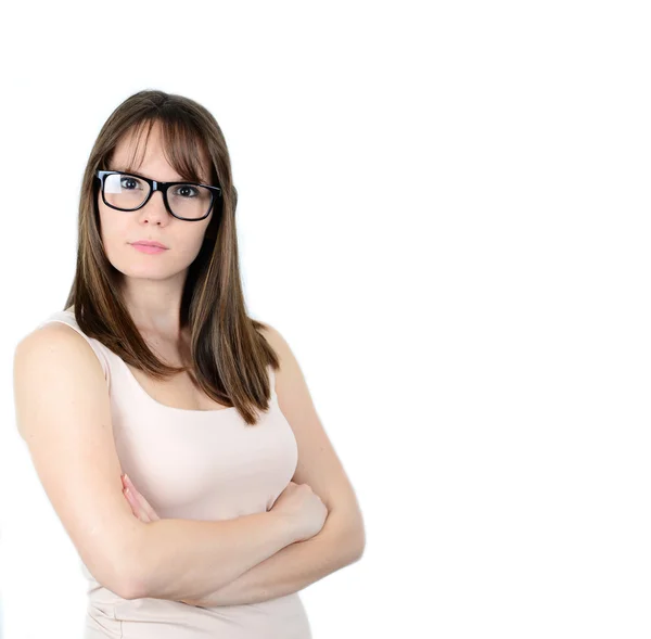 Pretty smiling young woman in black glasses with crossed arms on — Stock Photo, Image