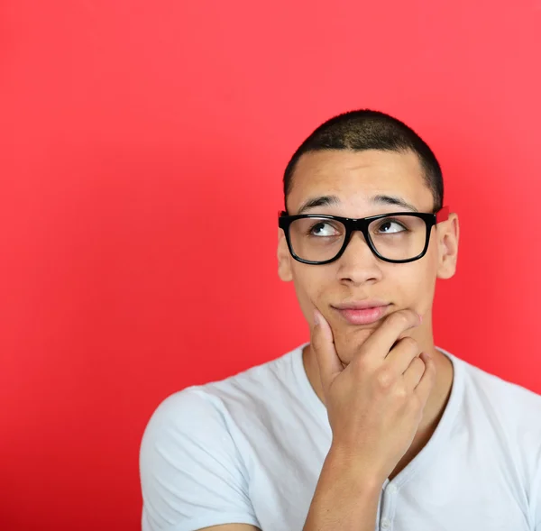 Portrait of a funny businessman with fingers on chin while think — Stock Photo, Image