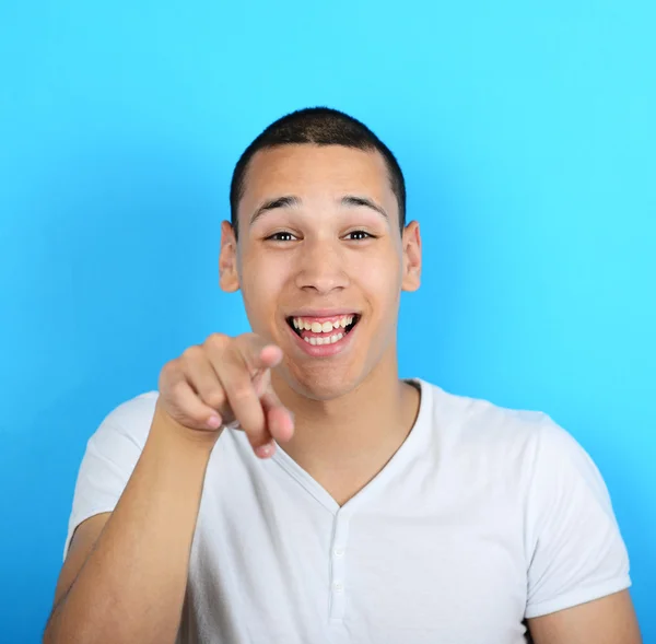 Portrait of handsome man laughung out loud against blue backgrou — Stock Photo, Image