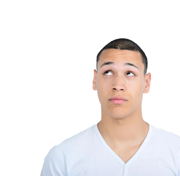 Portrait of happy young man looking up against white background — Stock Photo, Image