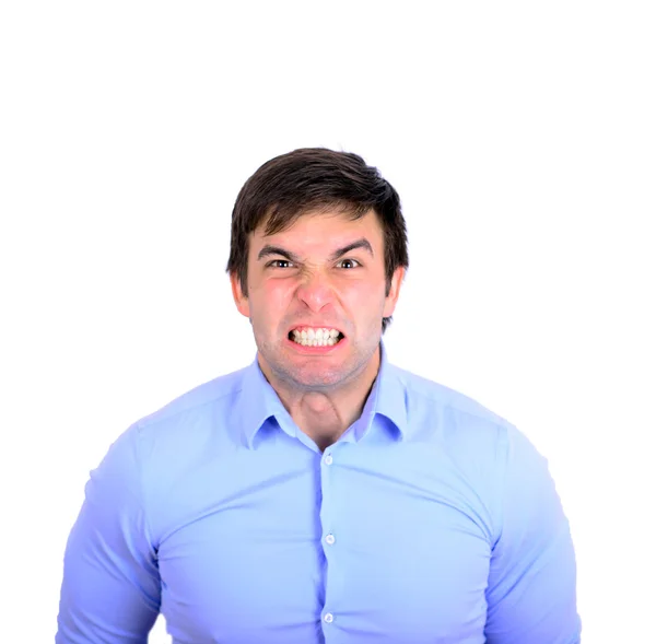 Portrait of angry young man looking straight forward — Stock Photo, Image