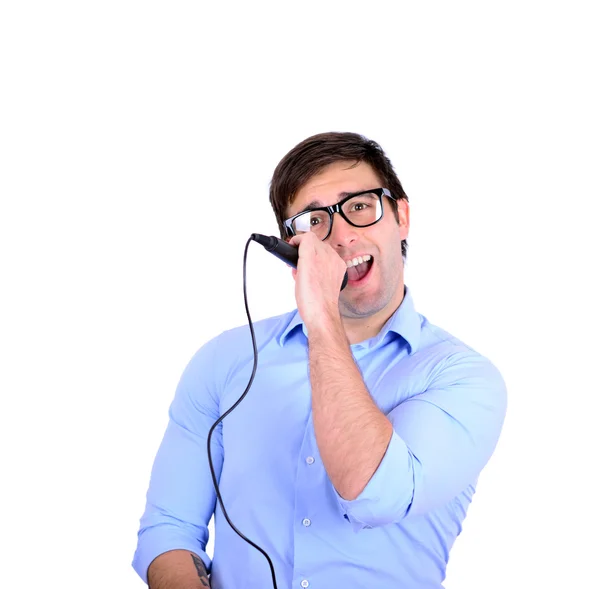 Portrait of handsome young man singing on microphone isolated o — Stock Photo, Image