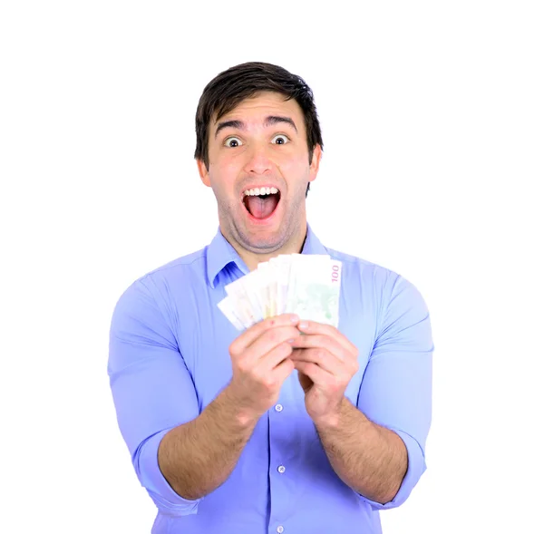 Portret młodego biznesmena szczęśliwy trzymając pieniądze w ręce — Zdjęcie stockowe