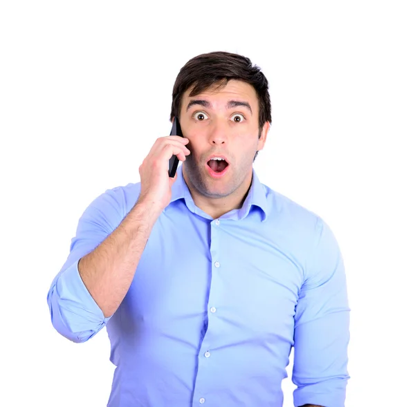 Shocked businessman talking on phone — Stock Photo, Image
