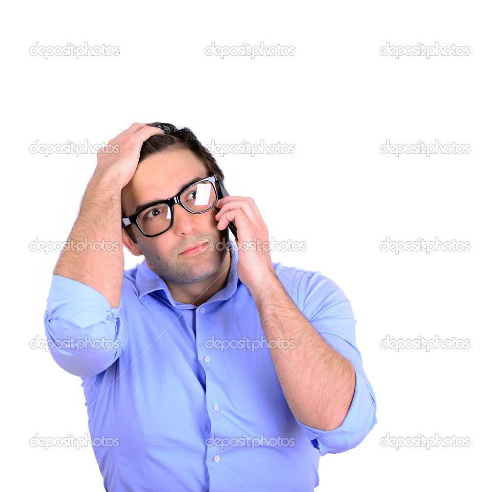 Shocked businessman talking on phone