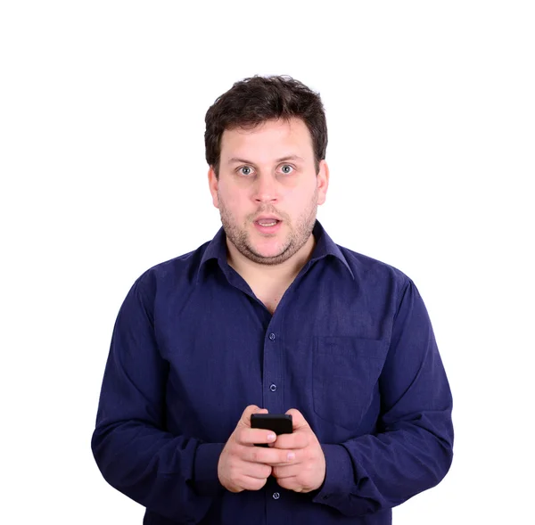 Shocked businessman looking at cell phone against white backgrou — Stock Photo, Image