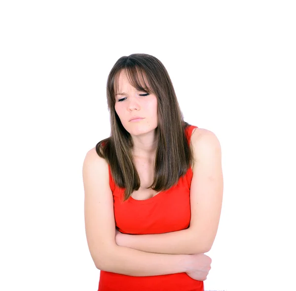 Jonge vrouw met maagpijn in studio met witte achtergrond — Stockfoto