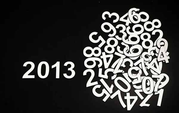 Digit 2013 and pile random numbers on black background — Stock Photo, Image