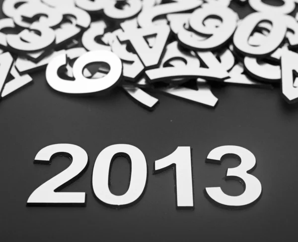 Digit 2013 and pile random numbers on black background — Stock Photo, Image