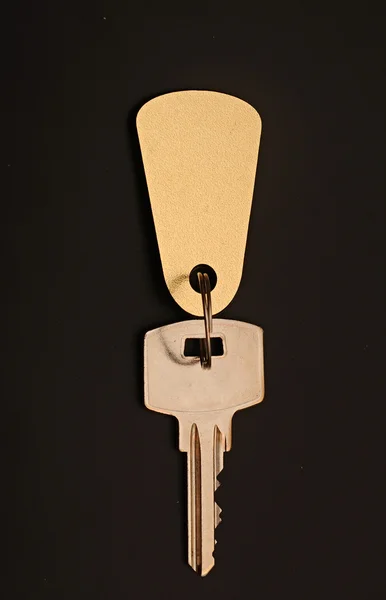 Room key on black background with space for your text — Stock Photo, Image