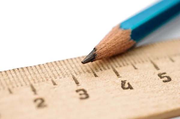 Closeup ruler and wood pencil on white — Stock Photo, Image