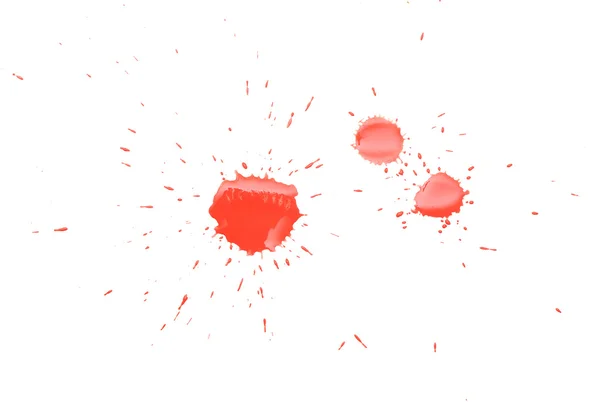 Manchas rojas con salpicaduras en la superficie blanca — Foto de Stock