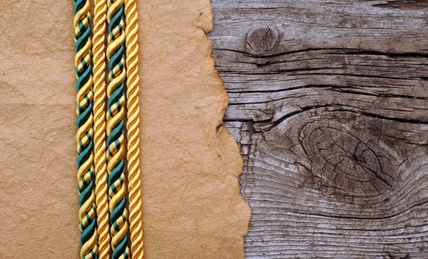 Vintage paper and color rope on old wooden boards — Stock Photo, Image