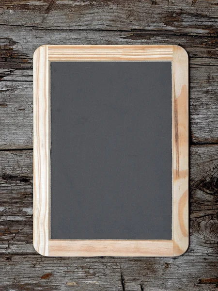 Grunge small blackboard hanging on wooden wall as a background f — Stock Photo, Image