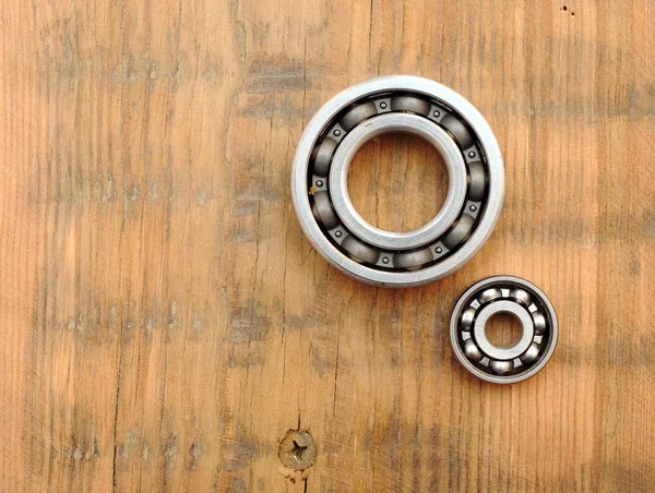 Steel ball bearings on wooden background — Stock Photo, Image