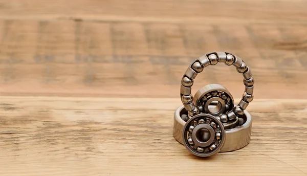 Steel ball bearings on wooden table. space for your text — Stock Photo, Image
