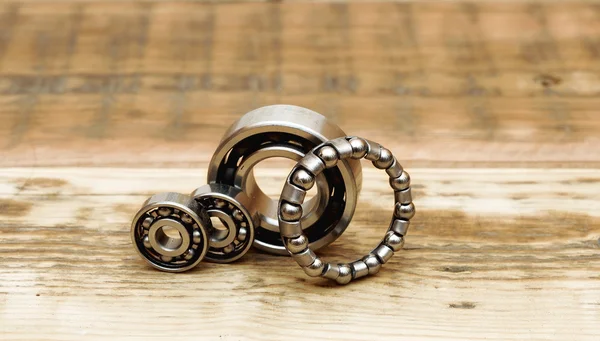Steel ball bearings on wooden table. space for your text — Stock Photo, Image