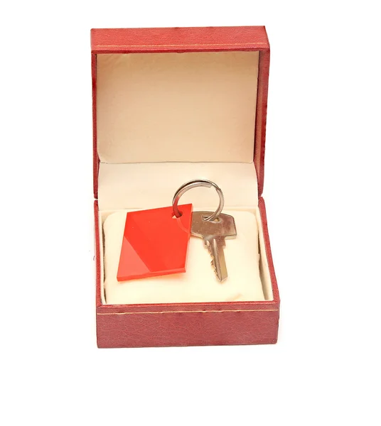 Keys in red gift box isolated on white — Stock Photo, Image