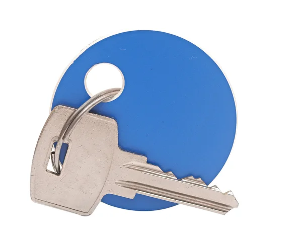 Key with a tag on a white background — Stock Photo, Image