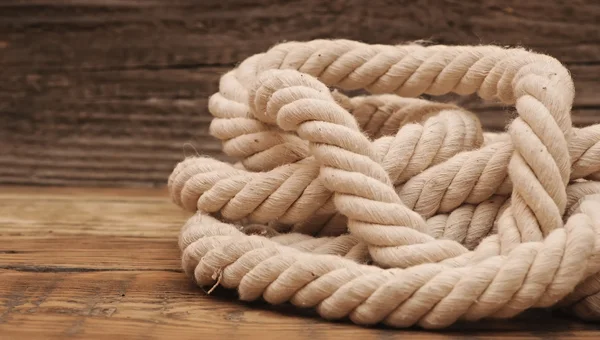 Ropes on a wooden background — Stock Photo, Image