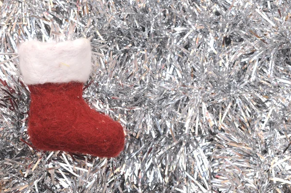 Christmas sock on silver tinsel — Stock Photo, Image