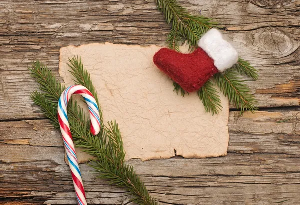 Sfondo di Natale con vecchia pergamena vuota e stivale di Natale — Foto Stock
