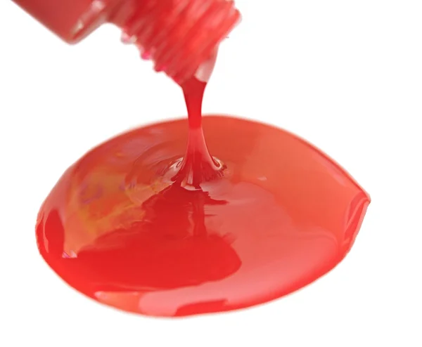 Close up of red drops of nail polish on white background — Stock Photo, Image
