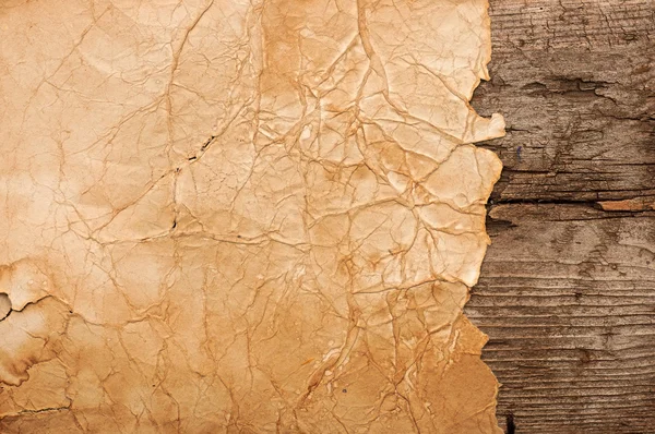 Grunge paper on wooden wall background — Stock Photo, Image