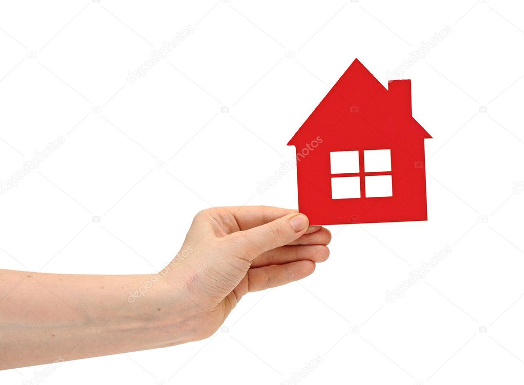 woman hand holding small red plastic house over white background