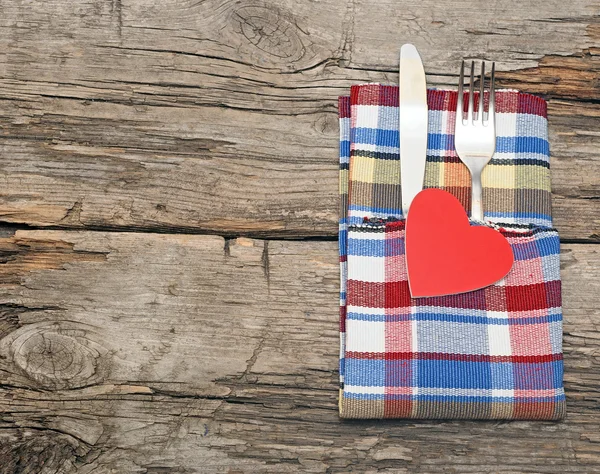 Cutlery set with colorful napkin and heart — Stock Photo, Image