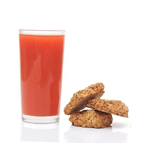 Tomato juice glass with cookies isolated on white background — Stock Photo, Image