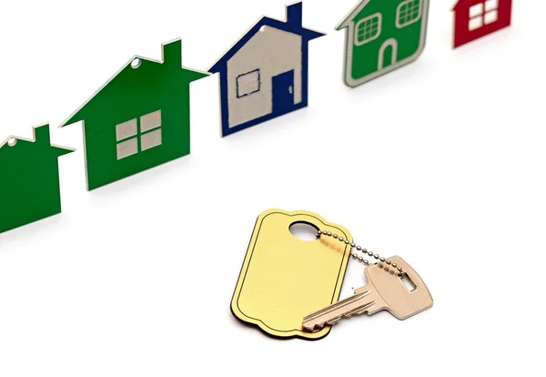Modelo casa símbolo conjunto y llave con etiqueta en blanco —  Fotos de Stock