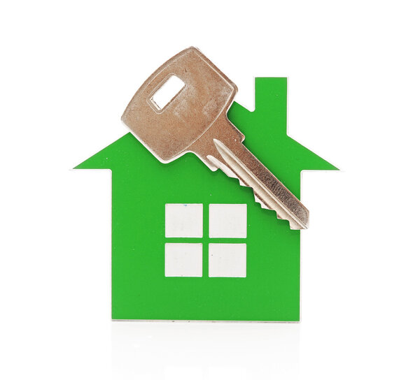 Keychain shaped like a house with a key on a white background. s