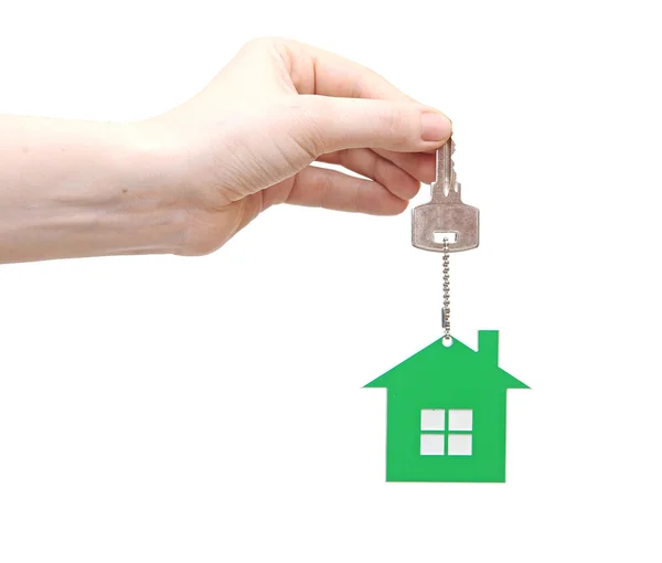 Hand is handing a house key — Stock Photo, Image