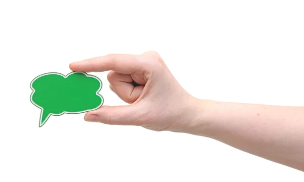 Ruka držící zelené řeči bublina symbolu — Stock fotografie