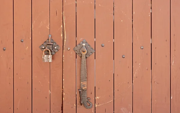 Wrought iron lock old wooden door — Stock Photo, Image