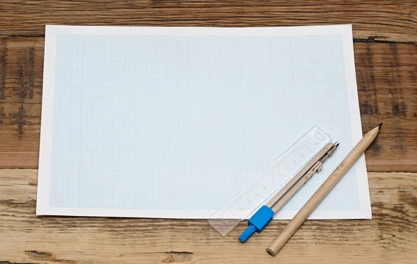 Geometrie aangezet grafiek papier met passer en liniaal — Stockfoto