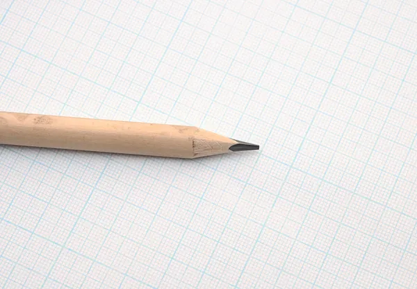 Pencil on graph paper background — Stock Photo, Image