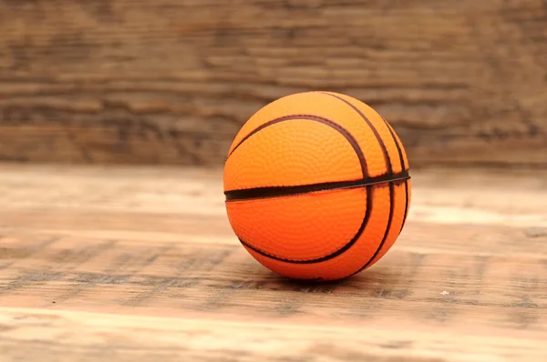 Toy basketball on wood background — Stock Photo, Image