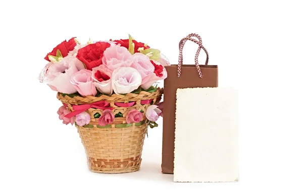 Paper flower in a basket with blank old photo frame — Stock Photo, Image