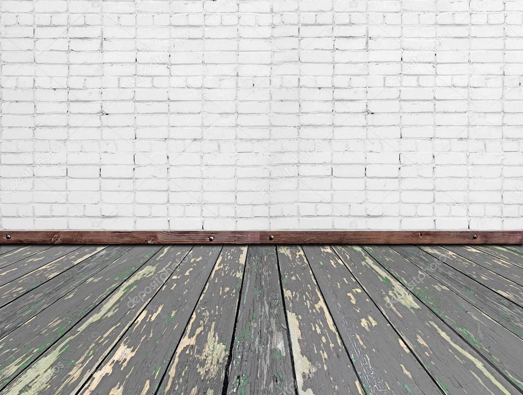 Interior room with white brick wall and wooden floor Stock Photo by