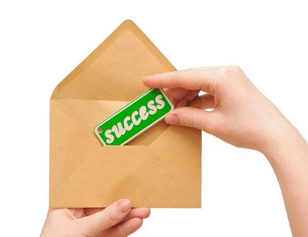 Woman hand holding envelope mail with message of success — Stock Photo, Image