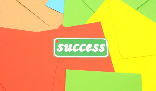 Message of success on colorful envelopes — Stock Photo, Image