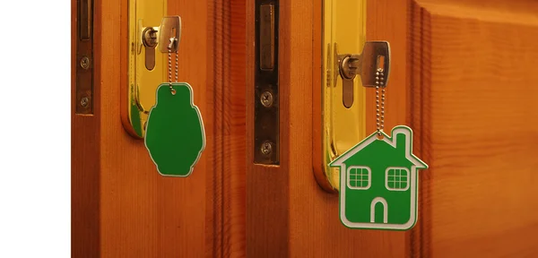 Σύμβολο της το σπίτι και το ραβδί το κλειδί σε την κλειδαρότρυπα — Φωτογραφία Αρχείου