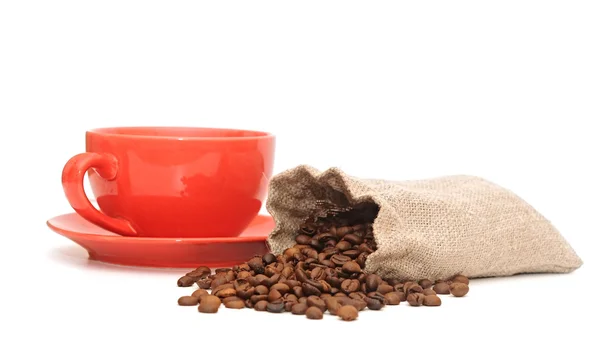 Red cup of coffee with sack of coffee beanson white background — Stock Photo, Image