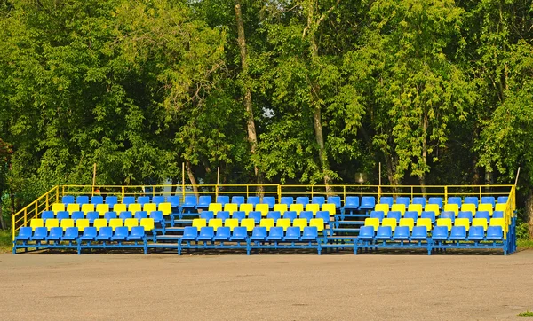 Blue and Yellow empty plastic seats — Stock Photo, Image