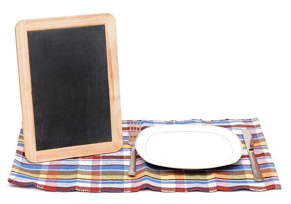 Menu blackboard lying on white background with plate, knife and — Stock Photo, Image